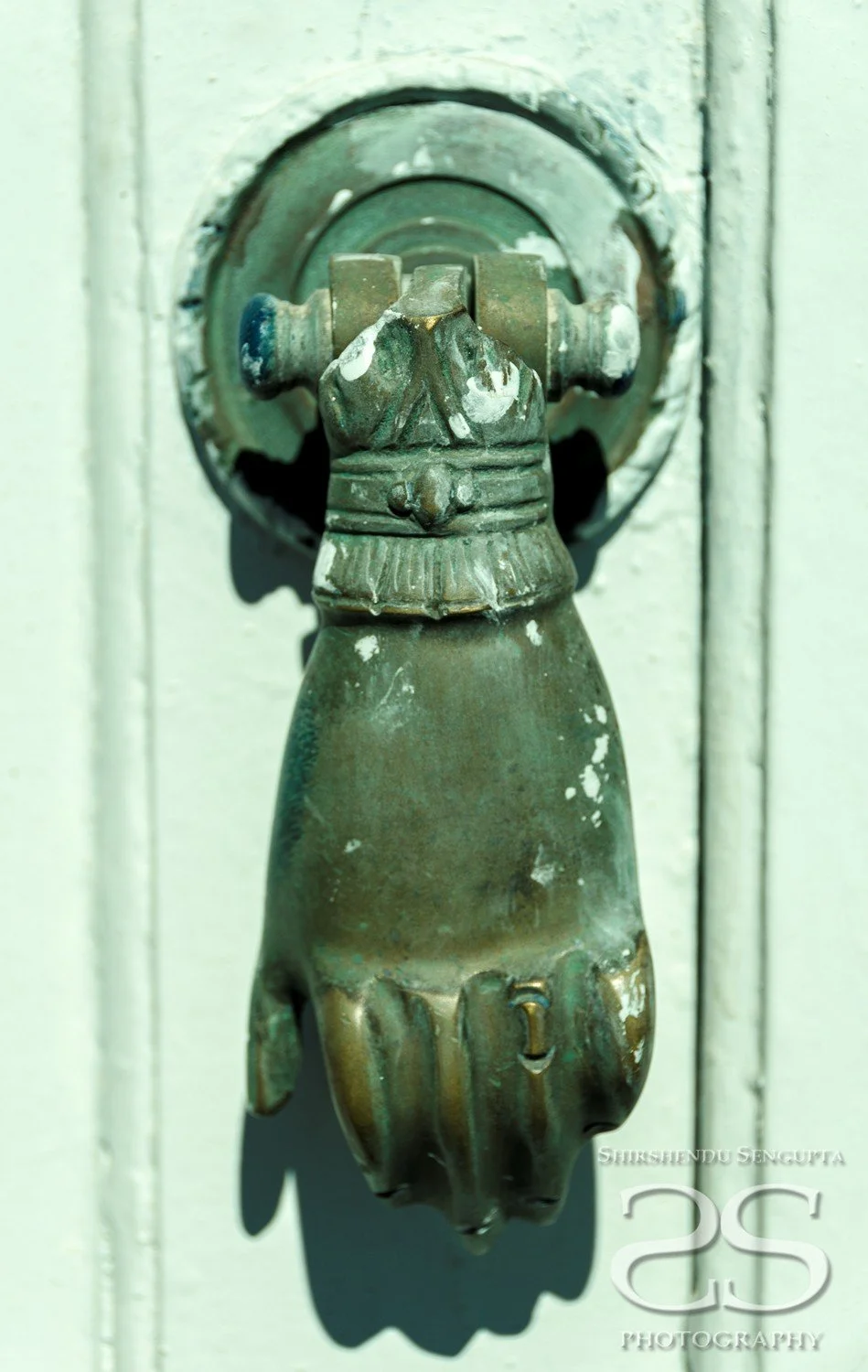 hand shaped door handle of white houses church blue domes oia imerovigli firostefani fira village santorini greece caldera volcanic island