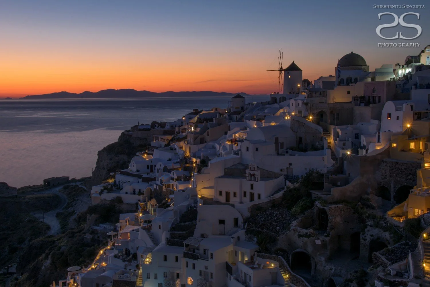 dusk at white houses church blue domes oia imerovigli firostefani fira village santorini greece caldera volcanic island