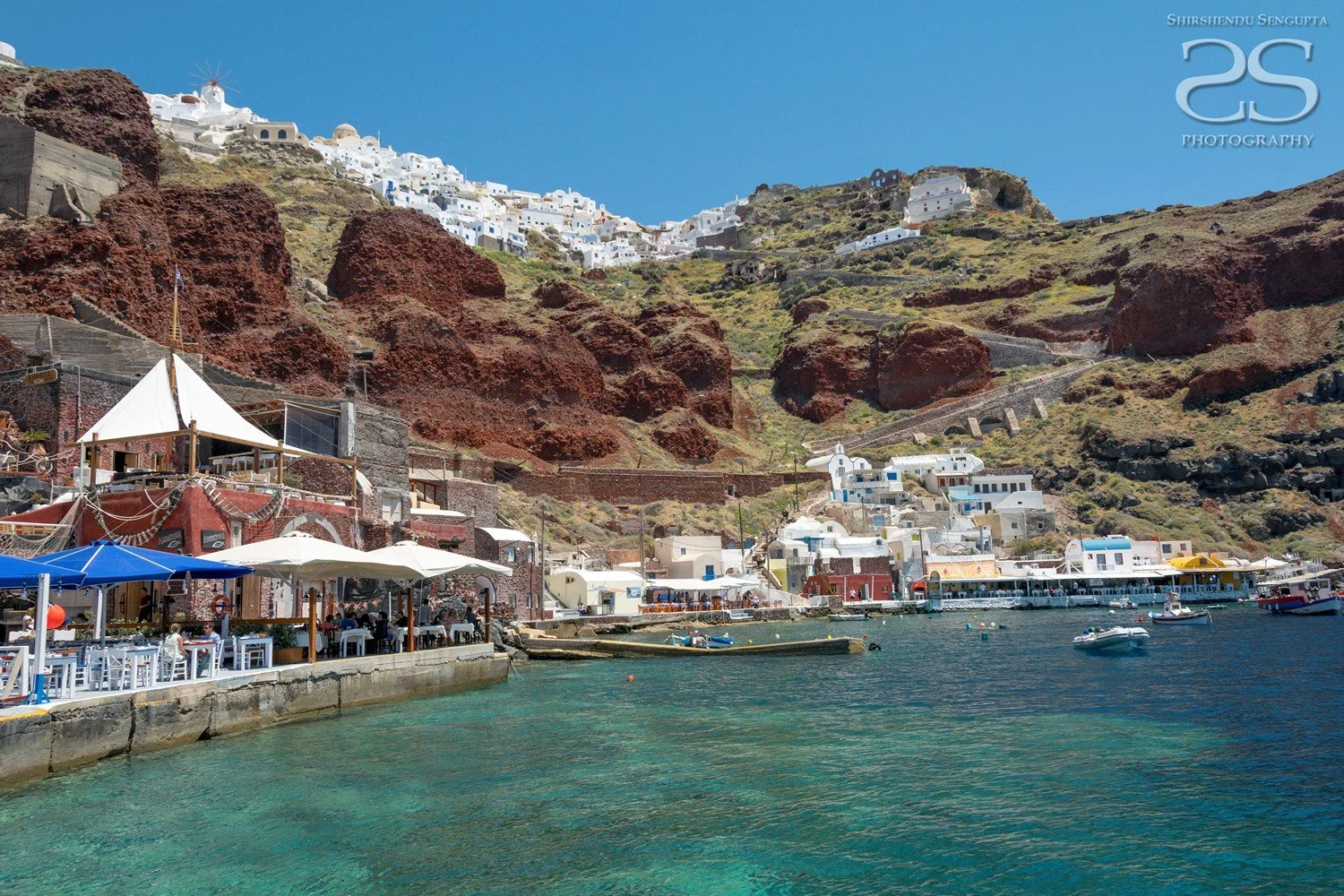 ammoudi harbor with white houses church blue domes oia imerovigli firostefani fira village santorini greece caldera volcanic island