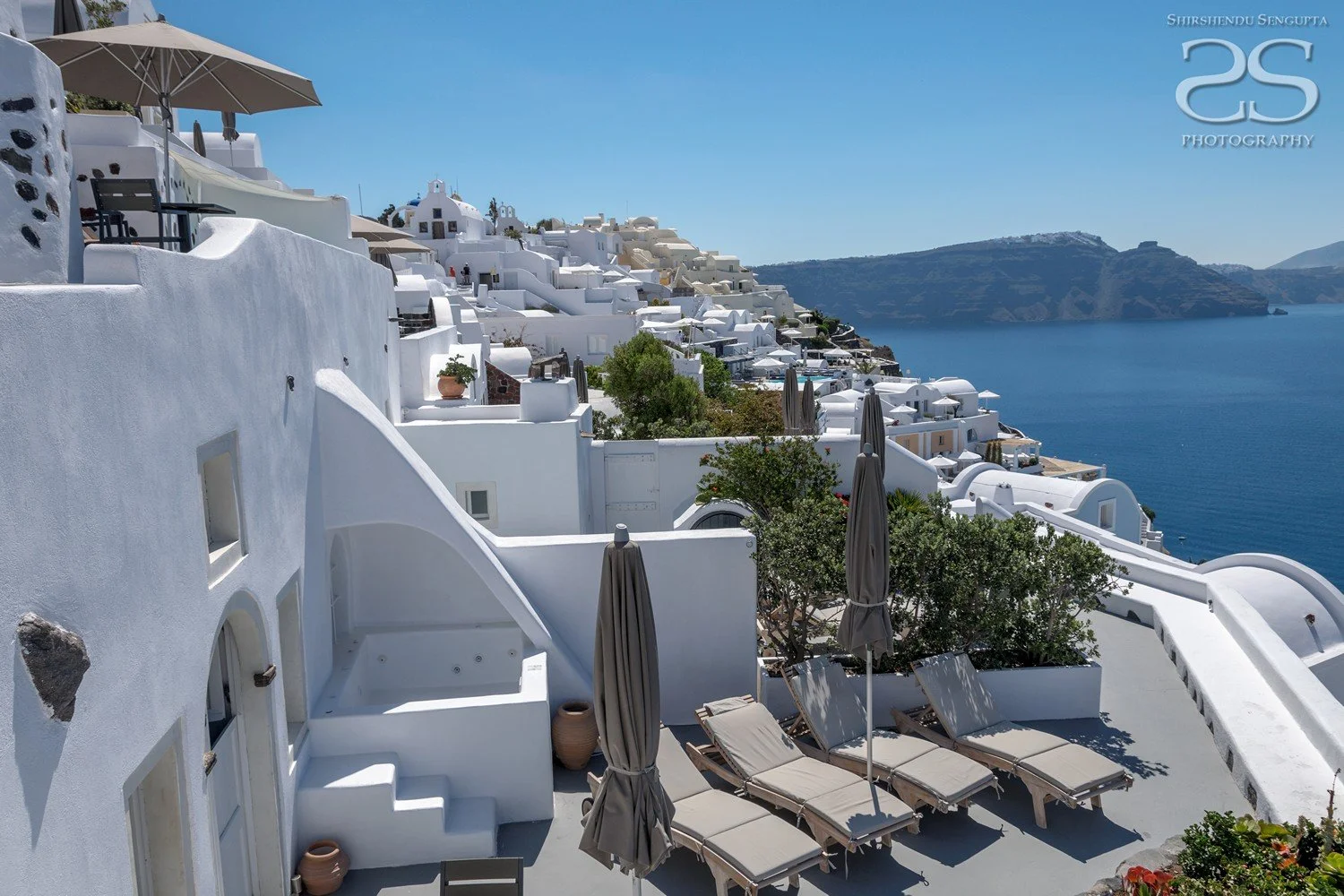 white houses church bell towers blue domes oia imerovigli firostefani fira village santorini greece caldera volcanic island